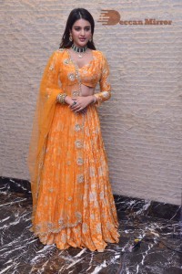 Actress Nidhhi Agerwal in a orange Lehenga Choli Dress