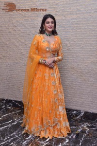 Actress Nidhhi Agerwal in a orange Lehenga Choli Dress