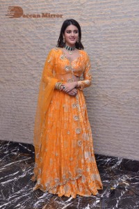 Actress Nidhhi Agerwal in a orange Lehenga Choli Dress