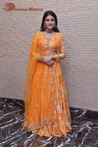 Actress Nidhhi Agerwal in a orange Lehenga Choli Dress