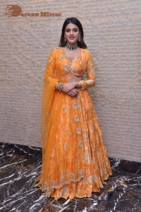 Actress Nidhhi Agerwal in a orange Lehenga Choli Dress