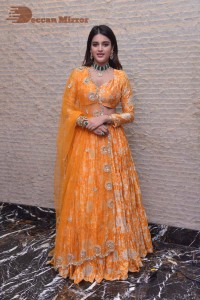 Actress Nidhhi Agerwal in a orange Lehenga Choli Dress