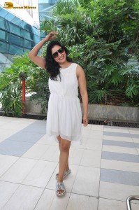 actress Niharica Raizada dressed in a white mini skirt