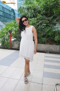 actress Niharica Raizada dressed in a white mini skirt