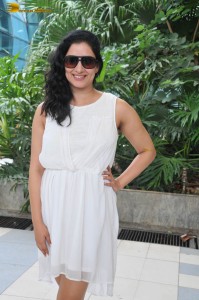 actress Niharica Raizada dressed in a white mini skirt