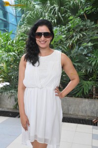 actress Niharica Raizada dressed in a white mini skirt