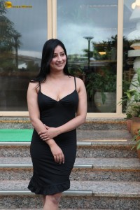actress Niharica Raizada sexy looks in a short black noodle strap dress
