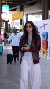 actress nikita dutta stylish in a coat and sunglasses