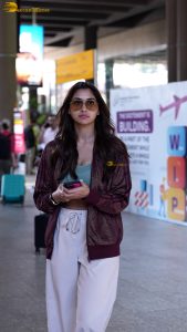 actress nikita dutta stylish in a coat and sunglasses