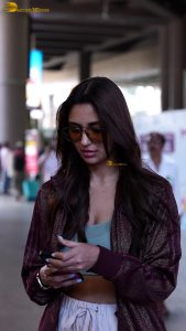 actress nikita dutta stylish in a coat and sunglasses