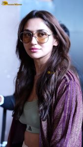 actress nikita dutta stylish in a coat and sunglasses