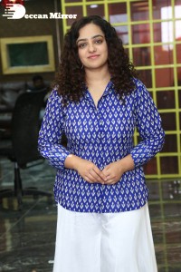 Actress Nithya Menen photoshoot in blue shirt and white trousers
