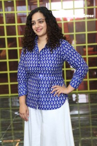 Actress Nithya Menen photoshoot in blue shirt and white trousers