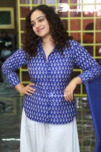 Actress Nithya Menen photoshoot in blue shirt and white trousers
