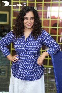 Actress Nithya Menen photoshoot in blue shirt and white trousers