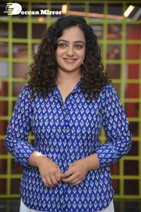 Actress Nithya Menen photoshoot in blue shirt and white trousers
