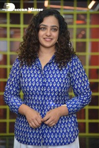 Actress Nithya Menen photoshoot in blue shirt and white trousers