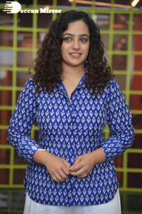 Actress Nithya Menen photoshoot in blue shirt and white trousers