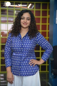 Actress Nithya Menen photoshoot in blue shirt and white trousers