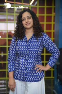 Actress Nithya Menen photoshoot in blue shirt and white trousers