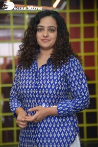 Actress Nithya Menen photoshoot in blue shirt and white trousers
