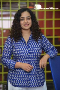 Actress Nithya Menen photoshoot in blue shirt and white trousers