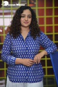 Actress Nithya Menen photoshoot in blue shirt and white trousers