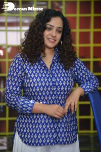Actress Nithya Menen photoshoot in blue shirt and white trousers