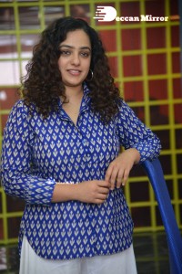 Actress Nithya Menen photoshoot in blue shirt and white trousers