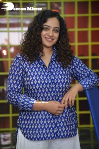 Actress Nithya Menen photoshoot in blue shirt and white trousers
