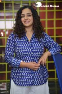 Actress Nithya Menen photoshoot in blue shirt and white trousers