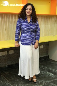 Actress Nithya Menen photoshoot in blue shirt and white trousers