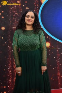 Nithya Menen in a green dress