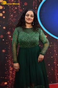 Nithya Menen in a green dress