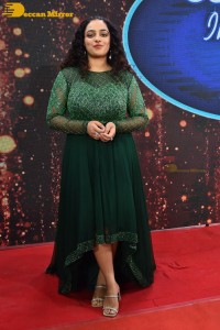 Nithya Menen in a green dress