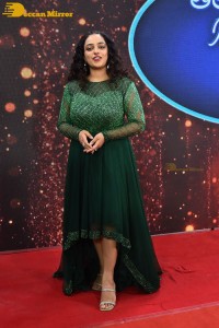 Nithya Menen in a green dress