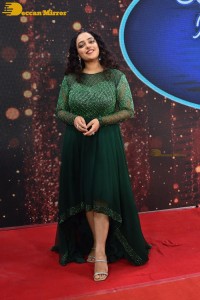 Nithya Menen in a green dress