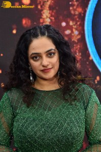 Nithya Menen in a green dress