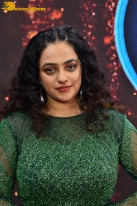 Nithya Menen in a green dress