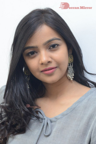 Telugu Actress Nithya Shetty in a grey dress