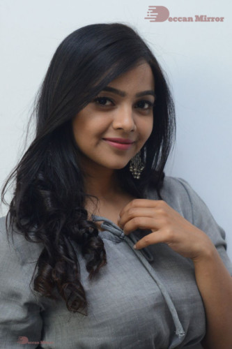 Telugu Actress Nithya Shetty in a grey dress