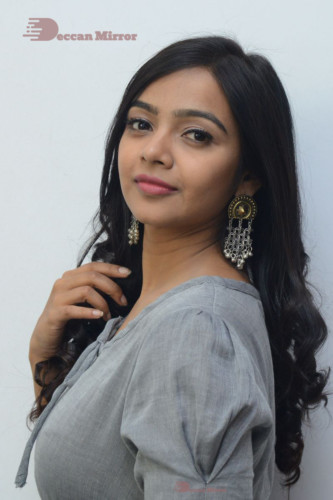 Telugu Actress Nithya Shetty in a grey dress