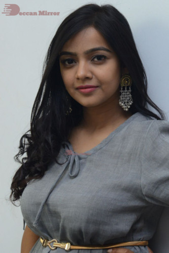 Telugu Actress Nithya Shetty in a grey dress