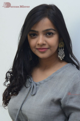 Telugu Actress Nithya Shetty in a grey dress