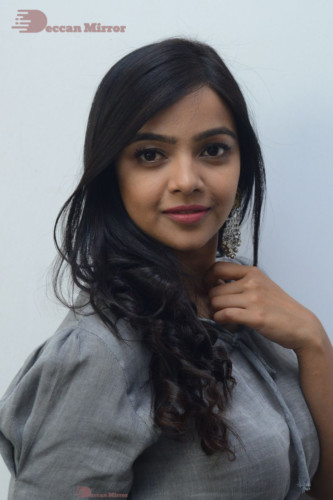 Telugu Actress Nithya Shetty in a grey dress