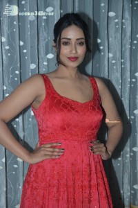 Actress Nivetha Pethuraj glamorous in a Red Dress attending the pre release function of movie Paagal