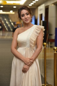 Nivetha Pethuraj in a shoulderless dress posing for photos