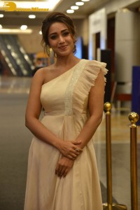 Nivetha Pethuraj in a shoulderless dress posing for photos