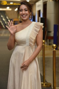 Nivetha Pethuraj in a shoulderless dress posing for photos