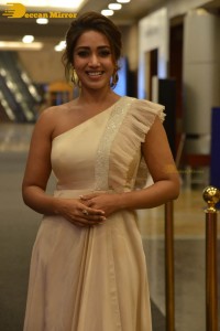 Nivetha Pethuraj in a shoulderless dress posing for photos